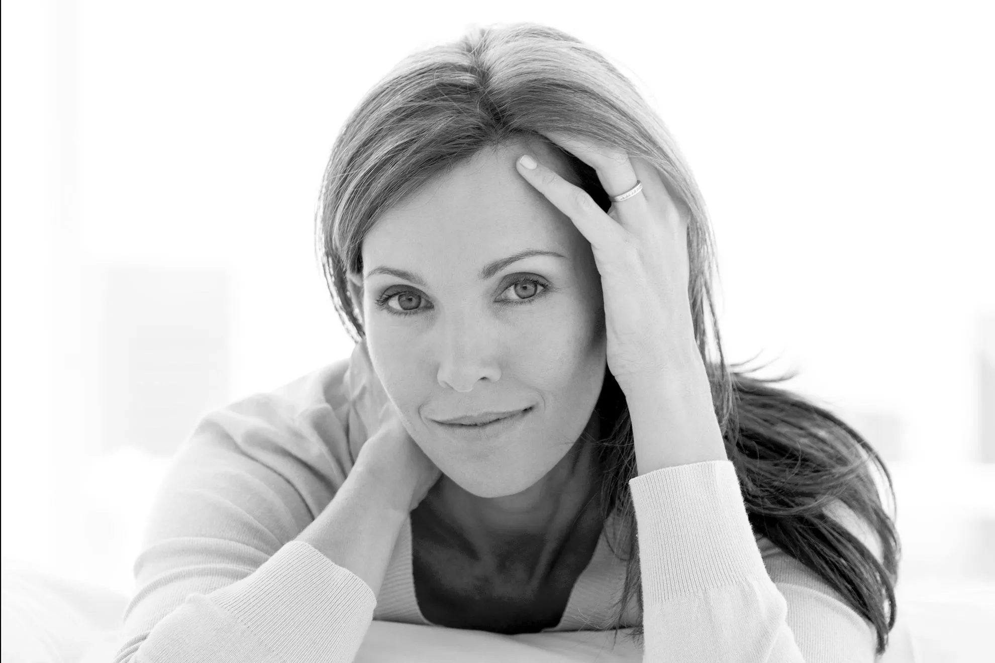 Smiling woman in black and white portrait