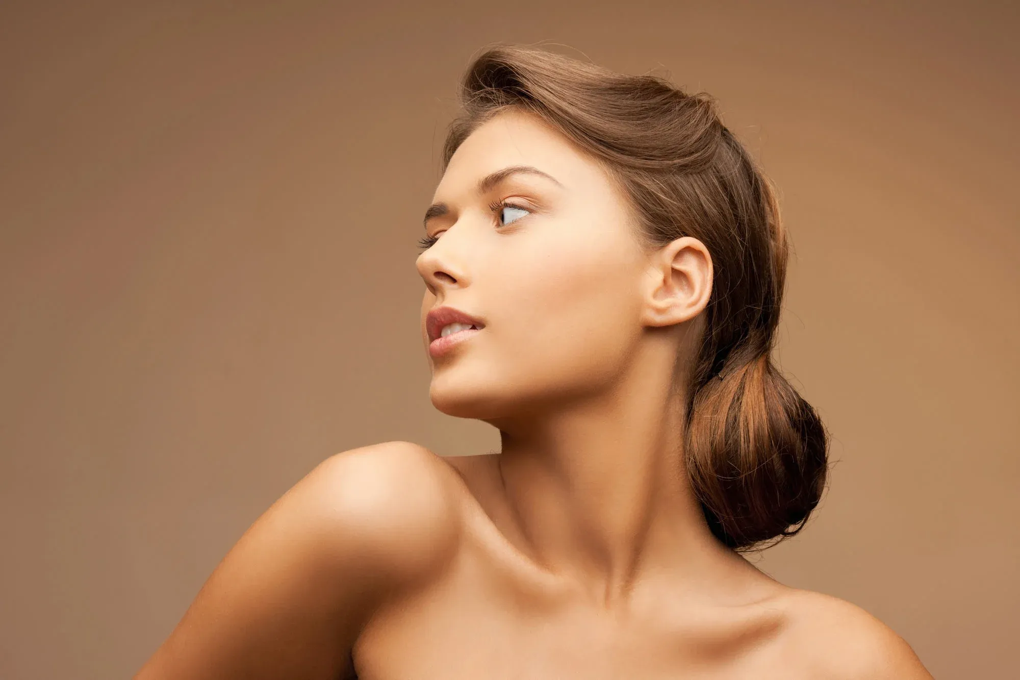 Woman with brown hair looking sideways