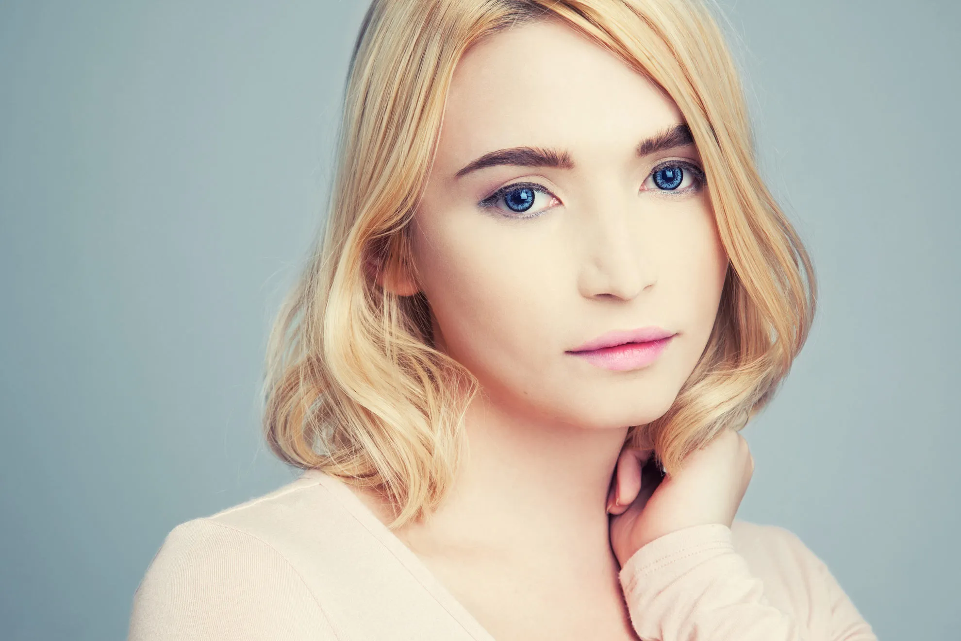 Portrait of a woman with blonde hair.